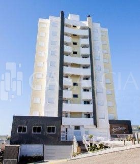 Apartamentos - 2 Dorm.<br />Santa Catarina<br />Caxias do Sul<br /><br />APARTAMENTO SEMI NOVO COM VISTA PANORÂMICA, EXCELENTE LOCALIZAÇÃO - PRÓXIMO À IGREJA DO SANTA LÚCIA/MERCADO/ ESCOLA/PONTO DE ÔNIBUS, 02 DORMITÓRIOS, SALA DE ESTAR E JANTAR, COZINHA, BANHEIRO COM MÓVEL, ÁREA DE SERVIÇO, SACADA COM CHURRASQUEIRA, 01 VAGA DE GARAGEM COBERTA. CONDOMÍNIO COM ALARME, GÁS CENTRAL, HIDRÔMETROS INDIVIDUAIS, PISO LAMINADO, ESQUADRIAS EM ALUMÍNIO, MONITORAMENTO E CÂMERAS. PRÉDIO COM ELEVADOR E SALÃO DE FESTAS MOBILIADO. POSIÇÃO SOLAR SUL E LATERAL OESTE 0-0
